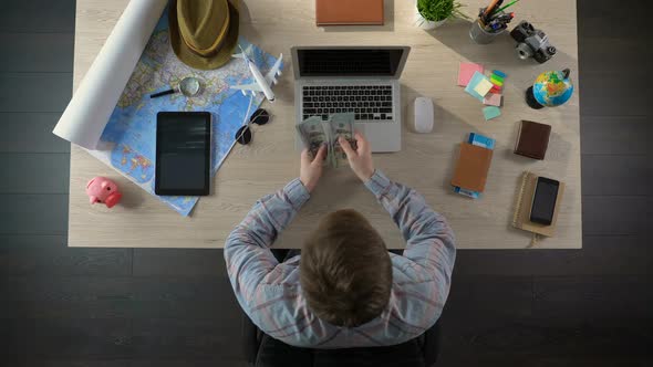 Rich Tourist Counting Cash to Spend During His Luxury Vacation, Planning Budget