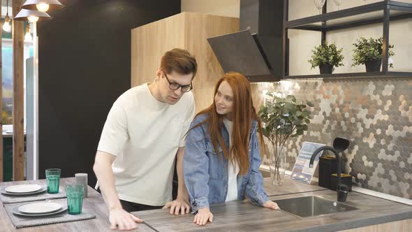 Adorable Caucasian Couple Came To Choose Interior for Future Kitchen