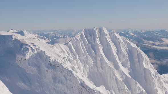 Aerial View of Canadian Mountain Covered in Snow