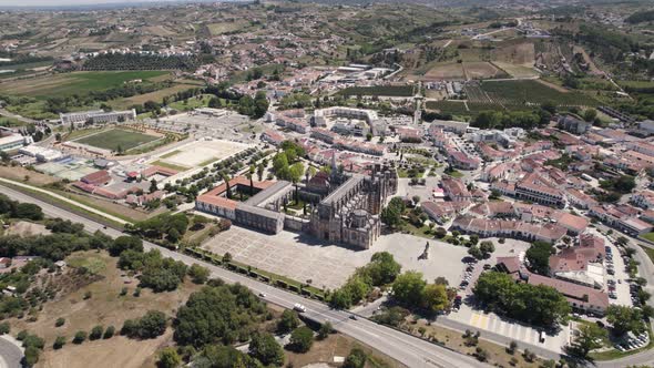 Aerial backwards view of the monastery of Batalha, with its surrounding wide area. Portugal