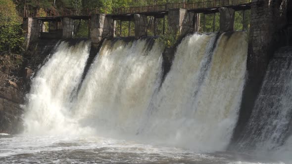 Dam with Flowing Water Through Gates