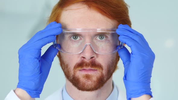 Redhead Scientist, Doctor Wearing Protective Glasses