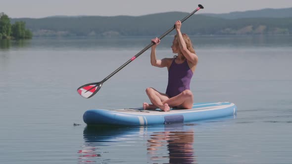 Girlfriends on Sup Board in Water