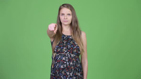 Young Beautiful Pregnant Woman Pointing To Camera