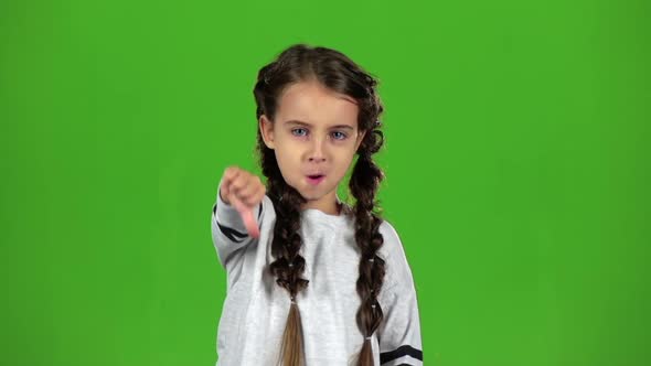 Baby Is Showing the Finger Down. Green Screen. Slow Motion