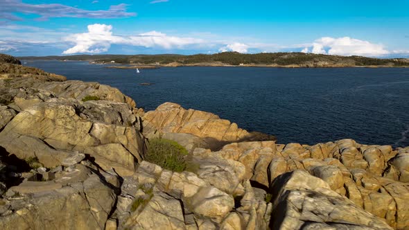 Beautiful Norwegian summer coastline dark blue sky with clouds in the background