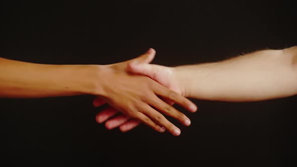 Diverse People Making Handshake Gesture Isolated on Black Background