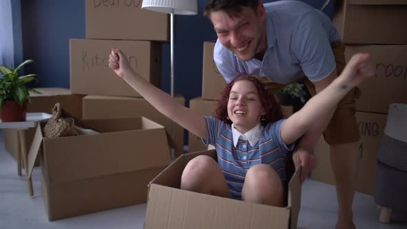 Man Rolls His Teenage Daughter in a Cardboard Box