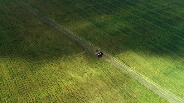 Combine Harvester Working In A Field