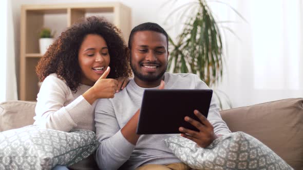 Couple Having Video Call on Tablet Pc at Home