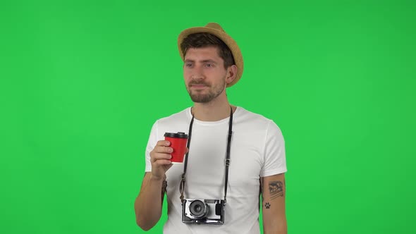 Portrait of Confident Guy Is Enjoying Coffee