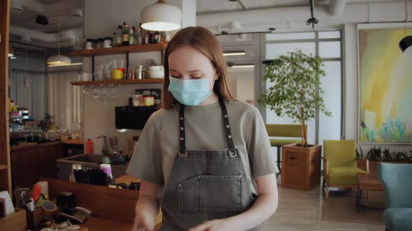 Barista Medical Face Mask in Coffee Shop Lockdown Quarantine Coronavirus is Over Back to Normal