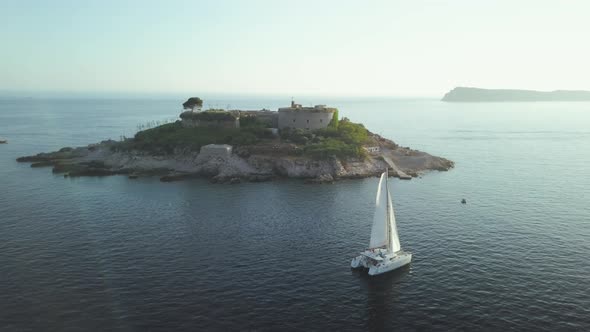 Aerial view of Yacht cruising on the sea or ocean in summer day in Montenegro.