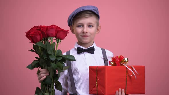 Boy in Cute Vintage Clothes With Bouquet of Roses and Gift Box, Valentines Day