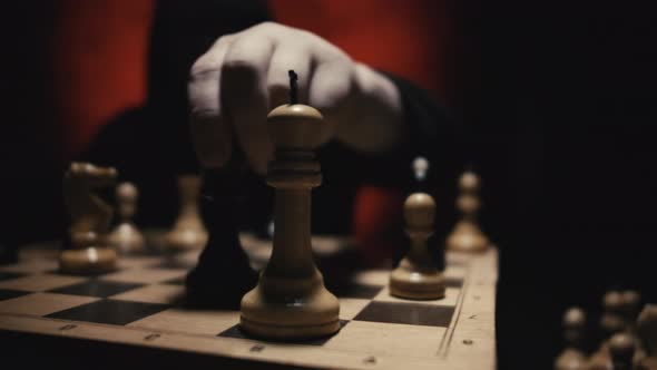 Close up of Unrecognizable Man in Hoodie Moving White Queen Defeating White King During Chess Game