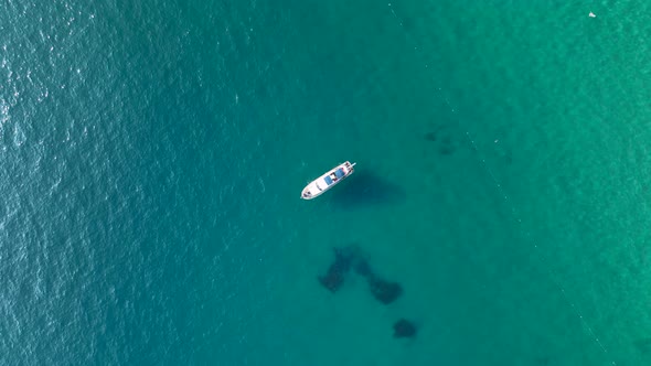 Luxury yacht sails to the port aerial view 4 K Turkey Alanya