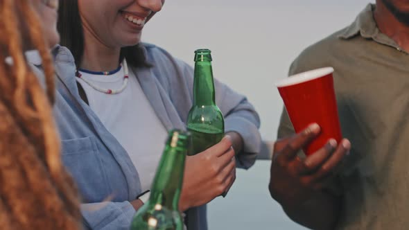 Cropped Young People Having Drinks