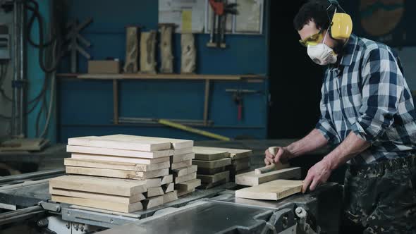 A Man Works with a Planer