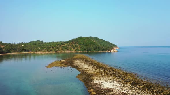 Aerial drone landscape of paradise tourist beach vacation by blue green water and white sand backgro