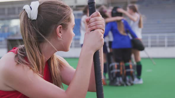 Female hockey player sad after a match