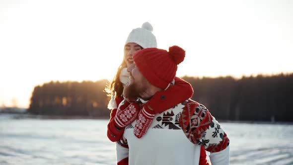 Happy Young Couple Dating in Winter Outside at Xmas Holidays Concept