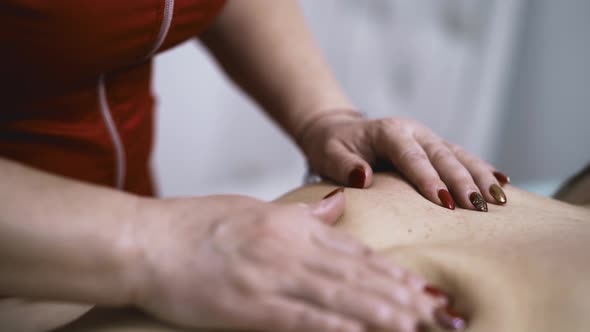 Patient Undergoes Massage with Skilled Therapist in Salon