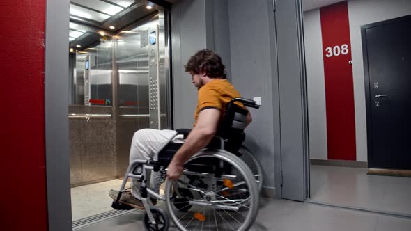 A Man Who Uses a Wheelchair Enters the Elevator