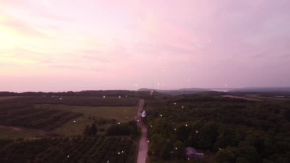 Fireworks Exploding In Sky At The Farm Country By The Road In Leelanau County, Michigan. - Wide Shot