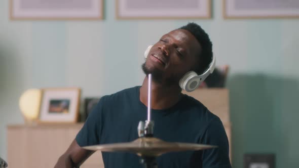 Happy Black Guy Playing Drums