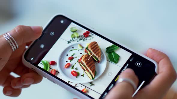 Female Hands Take Photos of Food By Modern Smartphone