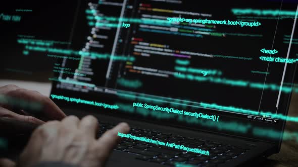 Programmer's Hands and Laptop Keyboard Closeup