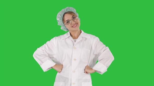 Female geek doctor with hands on hips on a Green Screen