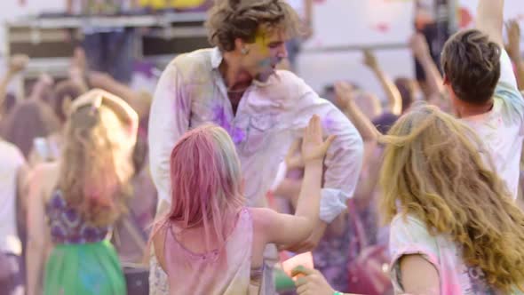 Wild Crowd Going Crazy at Cool Festival Friends Covered in Paint Taking Selfie