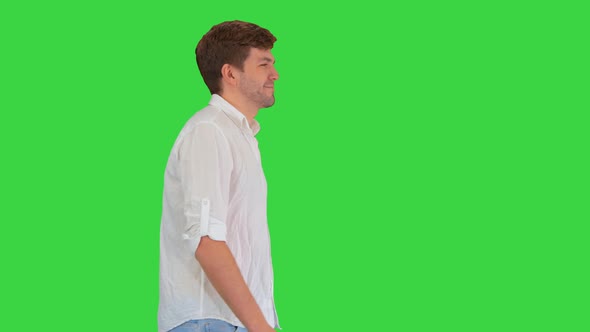 Casual Young Man Walking Looking Forward Green Screen Chroma Key