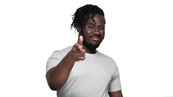 Portrait of Handsome Muscular African Man Wearing Pigtails and Mustache Gesturing at Camera Index