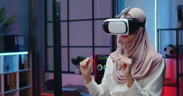 Mulsim Businesswoman in Light Violet Hijab Wears Special 3d Glasses During Overtime Work