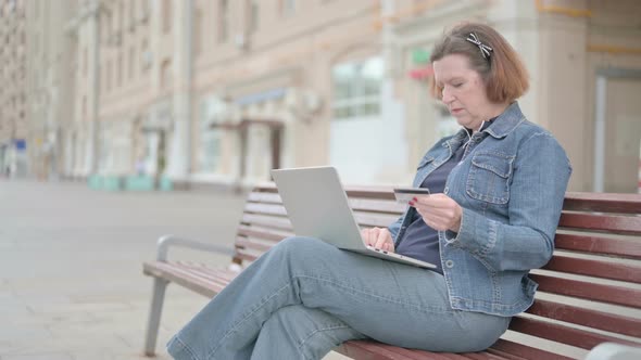 Old Woman Making Successful Online Payment on Laptop