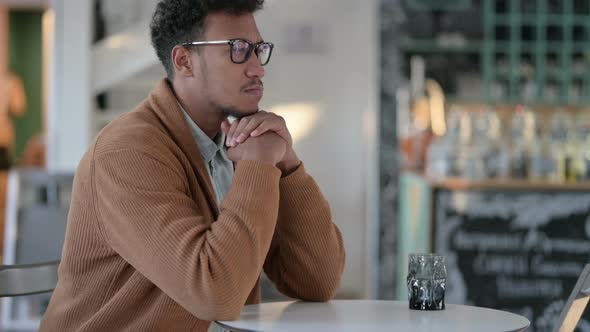 Pensive African Man Thinking Cafe