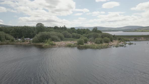 People Swimming At The Blessington Lake In County Wicklow, Ireland During Holidays - drone shot