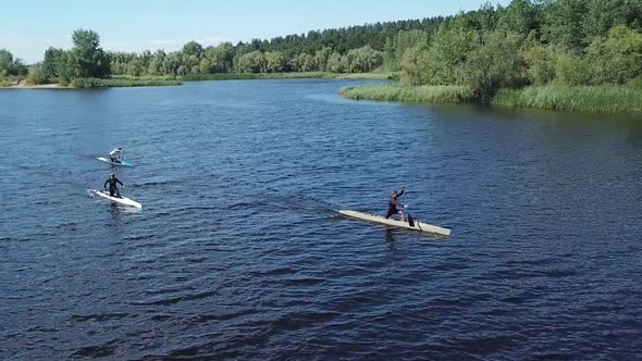 Professional Sportsmen Canoeist Paddling in Canoe on River at Nature