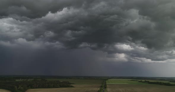 Aerial Dark Ominous Grey Storm Clouds. Dramatic Sky. Lighting In Dark Stormy Clouds