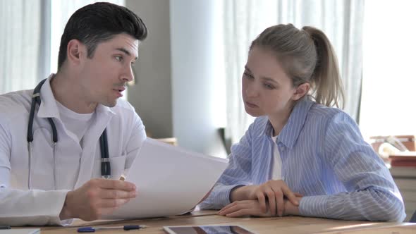 Doctor Giving Prescription to Patient