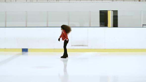 Little Athlete Skating on Indoor Ice Rink