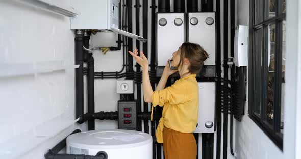 Woman Having a Problem with Heating System at Home
