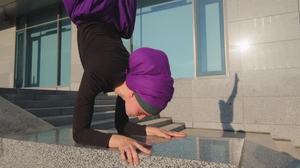 Cropped View Strong Active Muslim Girl Athlete Yogi Woman in Purple Hijab Standing on Arms in City