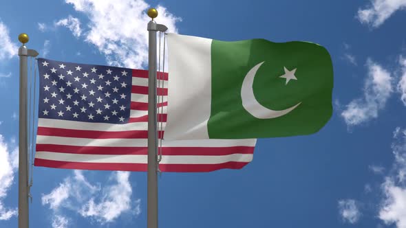 Usa Flag Vs Pakistan Flag On Flagpole