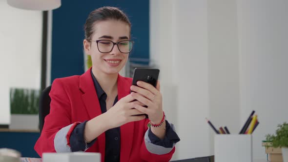 Company Accountant Checking Text Message on Smartphone