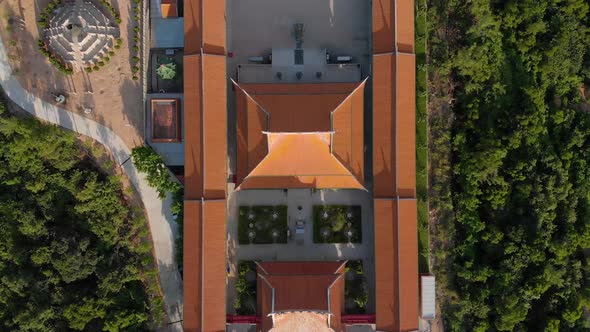 Rising top down aerial view of traditional Chinese temple in Macau