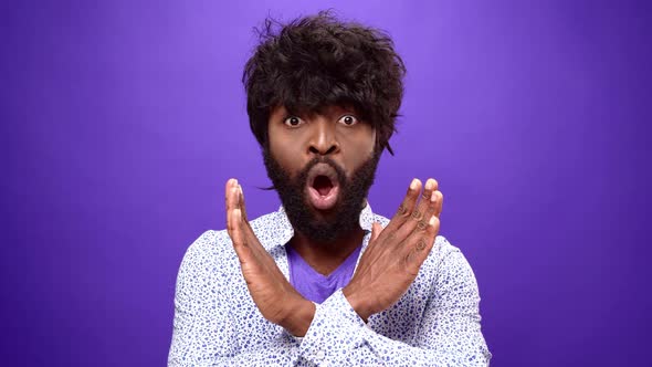 African American Guy Showing Reject Gesture Denies Something Purple Background