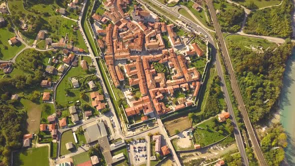 Aerial view of small old european town with red tiled roofs of small houses and narrow streets
